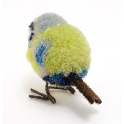 1451 - Toy: An early 20thC Steiff woollen model of a miniature blue tit bird, with felt tail and beak and w... 