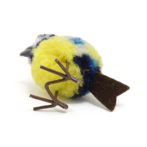 1451 - Toy: An early 20thC Steiff woollen model of a miniature blue tit bird, with felt tail and beak and w... 