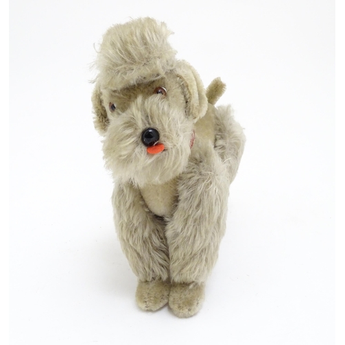 1452 - Toy: A 20thC Steiff mohair soft toy modelled as a Poodle dog - Snobby, with felt tongue, articulated... 