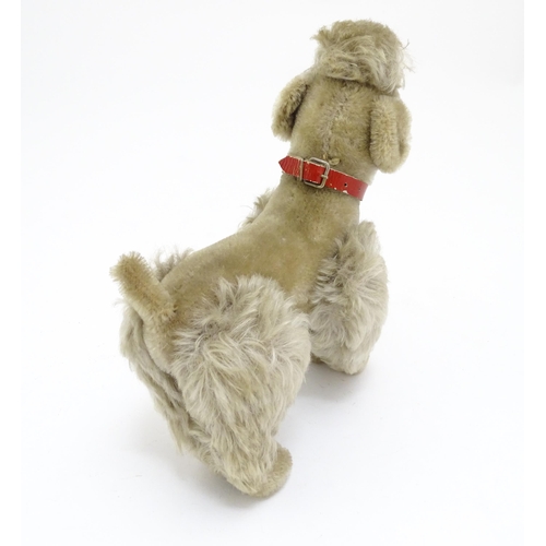 1452 - Toy: A 20thC Steiff mohair soft toy modelled as a Poodle dog - Snobby, with felt tongue, articulated... 