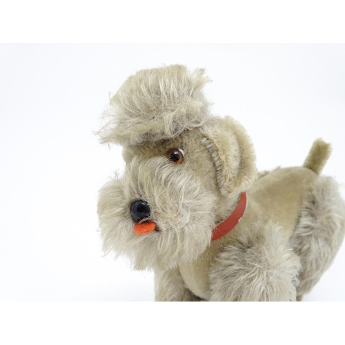 1452 - Toy: A 20thC Steiff mohair soft toy modelled as a Poodle dog - Snobby, with felt tongue, articulated... 