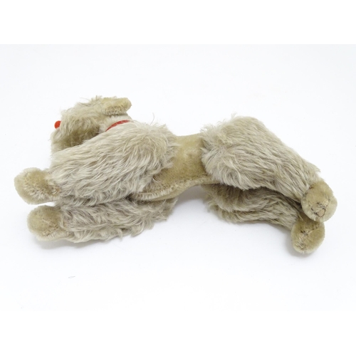 1452 - Toy: A 20thC Steiff mohair soft toy modelled as a Poodle dog - Snobby, with felt tongue, articulated... 