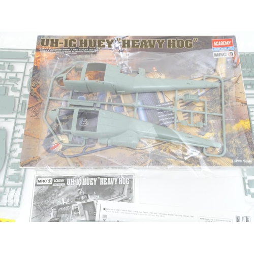 1454 - Toys: Two Academy Hobby Model / scale model kits comprising UH-IC Huey Heavy Hog helicopter, and M11... 