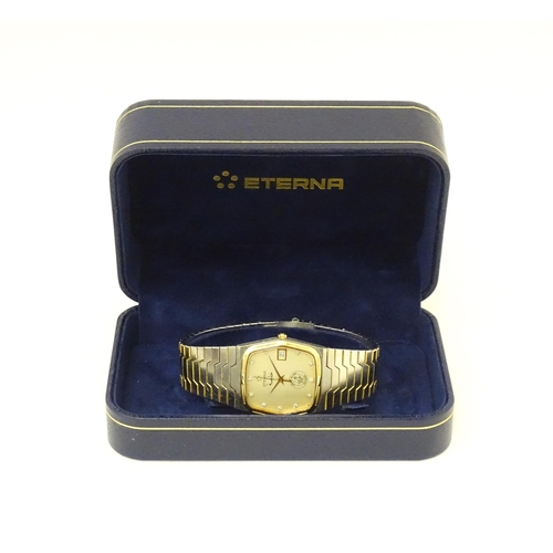 816 - An Eterna wristwatch, the watch dial signed Eterna and marked with State of Qatar national emblem. W... 