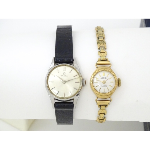 824 - A ladies Omega wind wristwatch together with a 9ct gold cased Gradus ladies wristwatch with gold pla... 