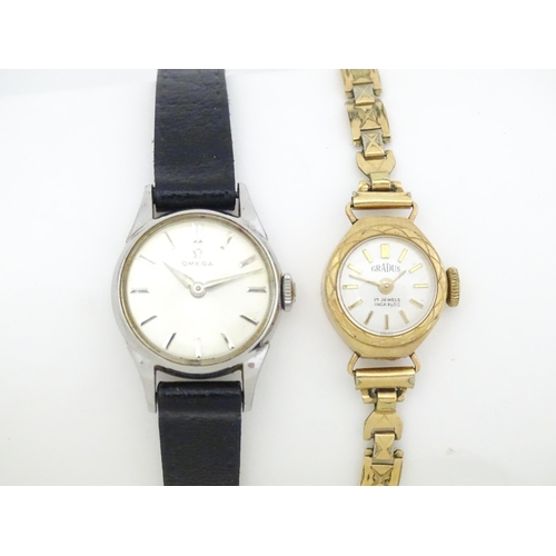 824 - A ladies Omega wind wristwatch together with a 9ct gold cased Gradus ladies wristwatch with gold pla... 