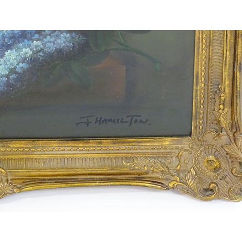 1801 - F. Hamilton, 20th century, Oil on canvas, A still life study with flowers in bloom on a marble ledge... 