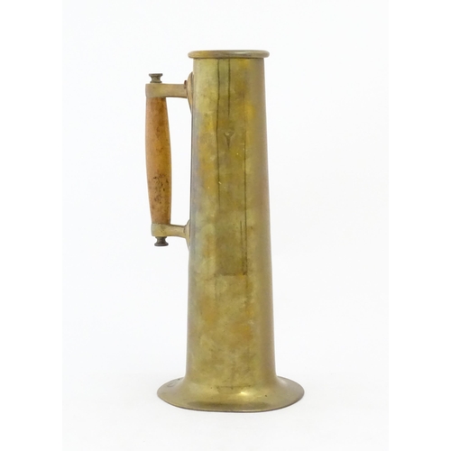 1086 - An Arts & Crafts vase of tapering form with a wooden handle and copper rivet detail. Approx. 11 1/2