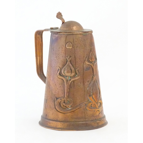 1087 - An Art Nouveau Joseph Sankey & Sons copper hot water jug with embossed floral and foliate decoration... 