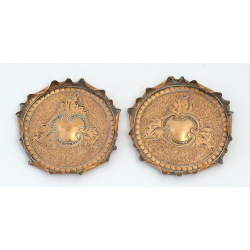 1089 - Two early 20thC copper dishes with embossed foliate decoration, punchwork detail and fluted rims. Ap... 