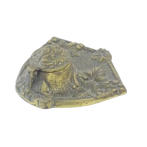 1096 - An early 20thC cast brass inkwell decorated with foliage and berries. Approx. 5