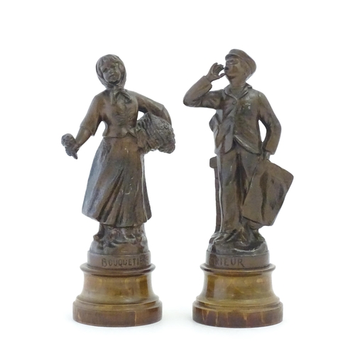 1102 - A pair of 20thC French spelter figures depicting street vendors comprising Flower seller and Newspap... 