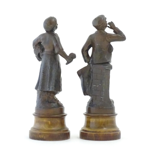 1102 - A pair of 20thC French spelter figures depicting street vendors comprising Flower seller and Newspap... 