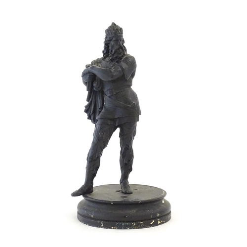 1103 - A 20thC spelter sculpture modelled as a medieval king. Raised on a turned wooden base. Approx. 15 3/... 