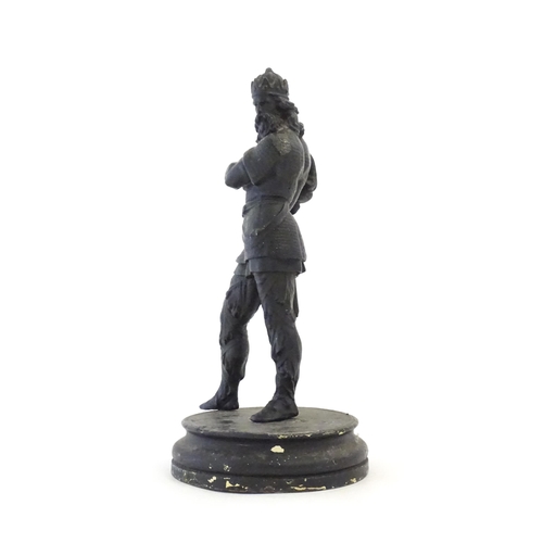 1103 - A 20thC spelter sculpture modelled as a medieval king. Raised on a turned wooden base. Approx. 15 3/... 