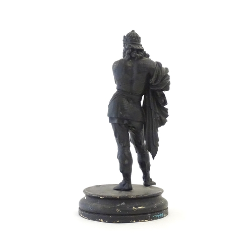 1103 - A 20thC spelter sculpture modelled as a medieval king. Raised on a turned wooden base. Approx. 15 3/... 