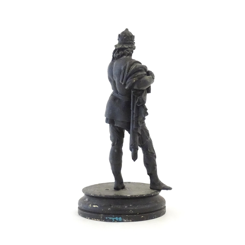 1103 - A 20thC spelter sculpture modelled as a medieval king. Raised on a turned wooden base. Approx. 15 3/... 