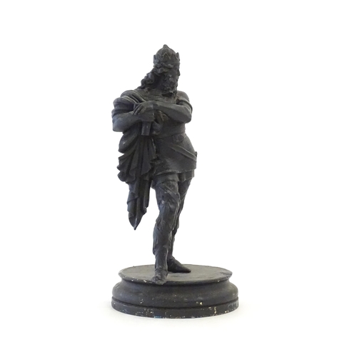 1103 - A 20thC spelter sculpture modelled as a medieval king. Raised on a turned wooden base. Approx. 15 3/... 