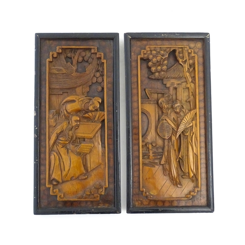 1125 - Two Oriental carved wooden panels, one depicting figures with fans in a garden, the other depicting ... 