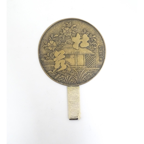 1132 - A Japanese kagami / hand mirror decorated with flowers, foliage, character script etc. Approx. 10