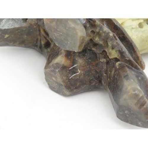 1138 - An Oriental soapstone carving depicting a bird, flower and foliage. Approx. 6