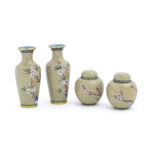 1153 - Four items of 20thC Chinese cloisonne ware to include a pair of vases and a pair of ginger jars, the... 