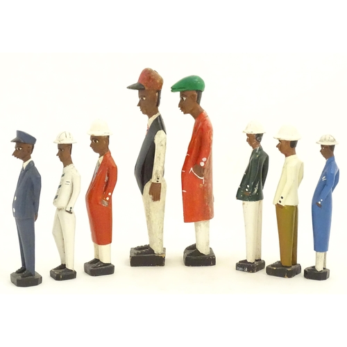 1159 - A quantity of 20thC carved hardwood African colonial figures with polychrome decoration. Largest app... 