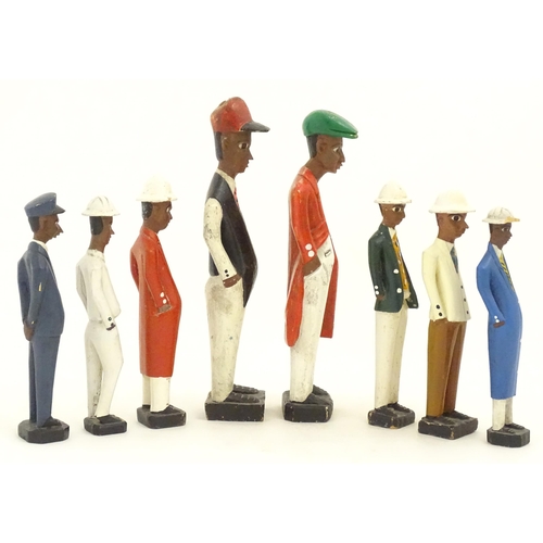 1159 - A quantity of 20thC carved hardwood African colonial figures with polychrome decoration. Largest app... 