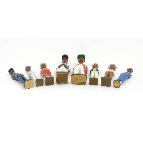 1159 - A quantity of 20thC carved hardwood African colonial figures with polychrome decoration. Largest app... 