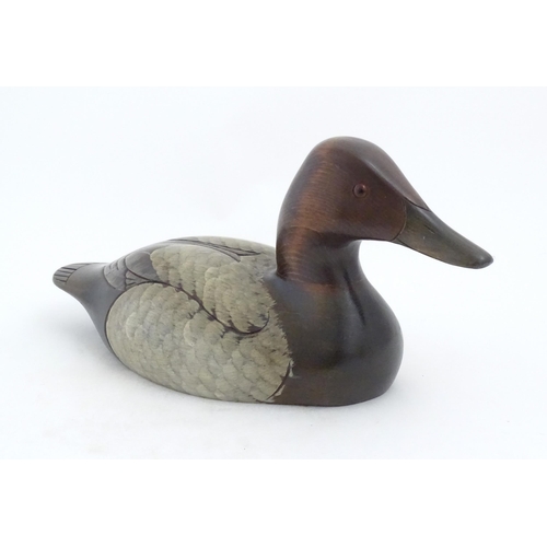 1168 - Shooting Interest: A 20thC American carved hardwood decoy duck by Craig Fellows designed exclusively... 