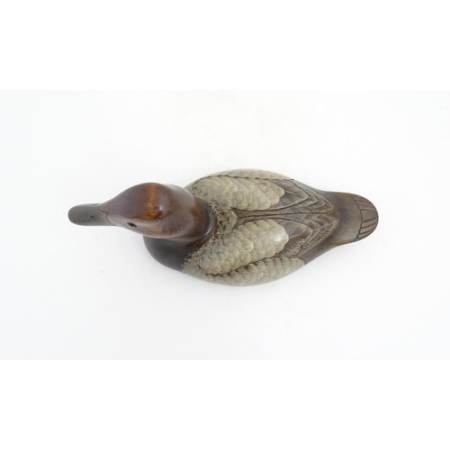 1168 - Shooting Interest: A 20thC American carved hardwood decoy duck by Craig Fellows designed exclusively... 