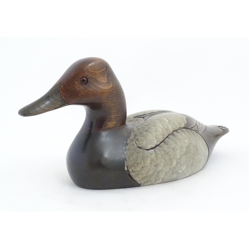 1168 - Shooting Interest: A 20thC American carved hardwood decoy duck by Craig Fellows designed exclusively... 