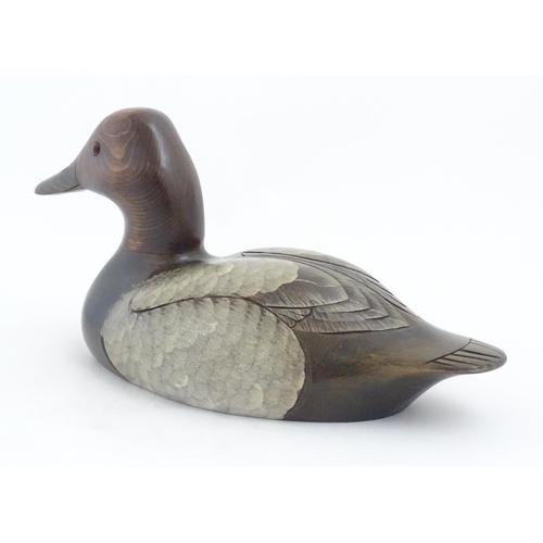 1168 - Shooting Interest: A 20thC American carved hardwood decoy duck by Craig Fellows designed exclusively... 