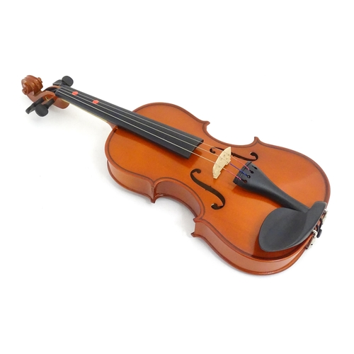 1173 - Musical Instrument: a student's 1/2 size 'Maestro' violin, in a fitted hard case, approx 18 1/2