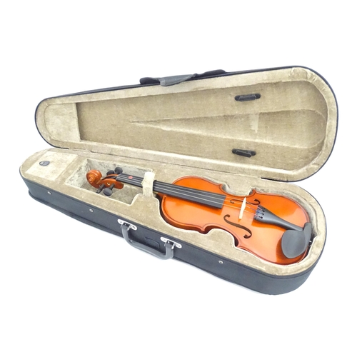 1173 - Musical Instrument: a student's 1/2 size 'Maestro' violin, in a fitted hard case, approx 18 1/2