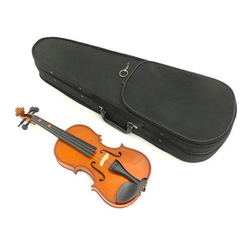 1173 - Musical Instrument: a student's 1/2 size 'Maestro' violin, in a fitted hard case, approx 18 1/2