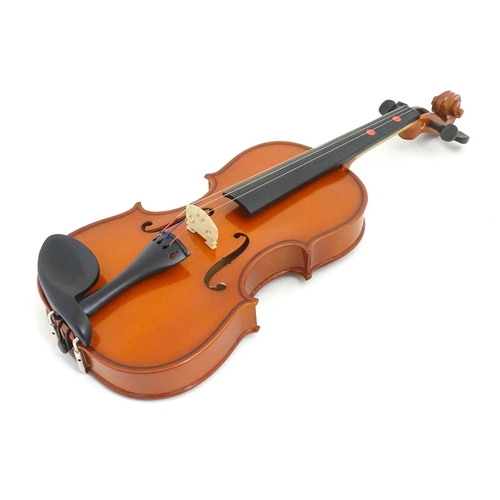 1173 - Musical Instrument: a student's 1/2 size 'Maestro' violin, in a fitted hard case, approx 18 1/2