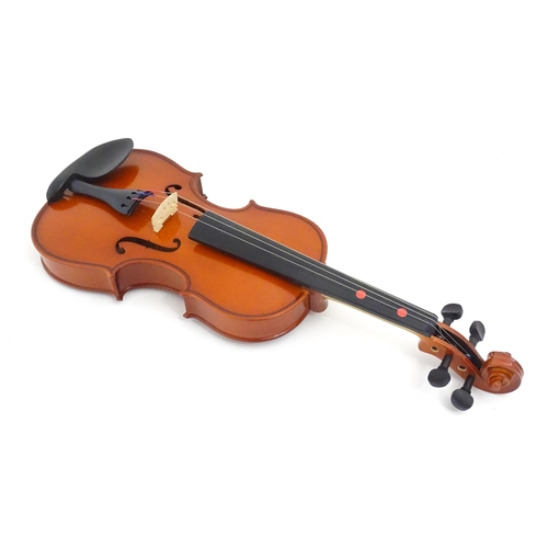 1173 - Musical Instrument: a student's 1/2 size 'Maestro' violin, in a fitted hard case, approx 18 1/2