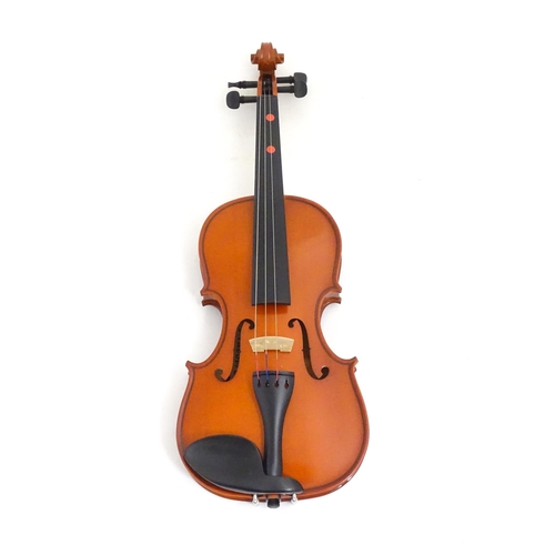 1173 - Musical Instrument: a student's 1/2 size 'Maestro' violin, in a fitted hard case, approx 18 1/2