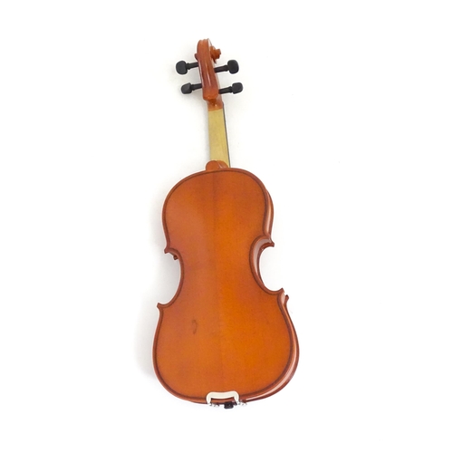 1173 - Musical Instrument: a student's 1/2 size 'Maestro' violin, in a fitted hard case, approx 18 1/2