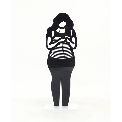 1176 - A 21stC laser cut acrylic statuette titled Backpack. Approx. 9 1/4