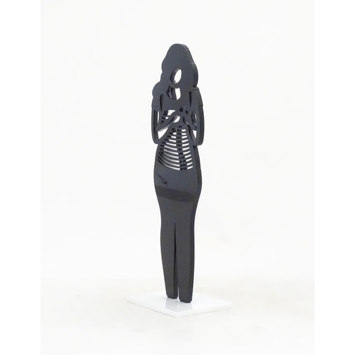 1176 - A 21stC laser cut acrylic statuette titled Backpack. Approx. 9 1/4