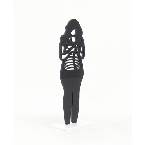 1176 - A 21stC laser cut acrylic statuette titled Backpack. Approx. 9 1/4