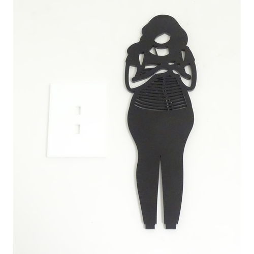 1176 - A 21stC laser cut acrylic statuette titled Backpack. Approx. 9 1/4