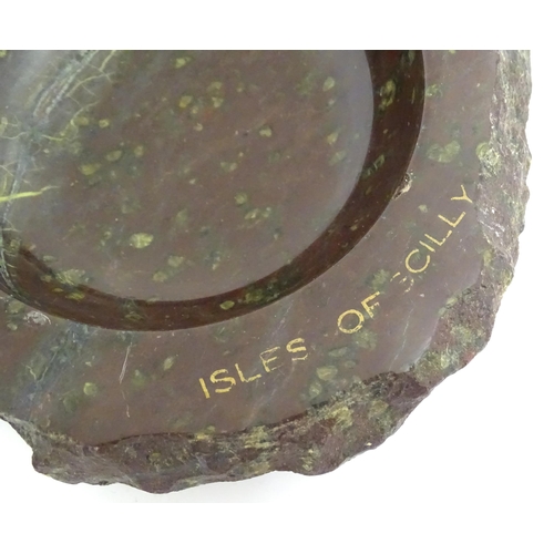 1180 - Four 20thC Cornish serpentine ashtrays, one titled Isles of Scilly. Largest approx. 6