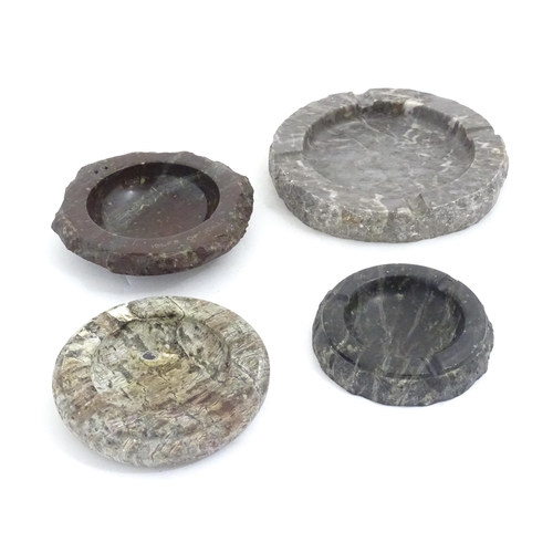 1180 - Four 20thC Cornish serpentine ashtrays, one titled Isles of Scilly. Largest approx. 6