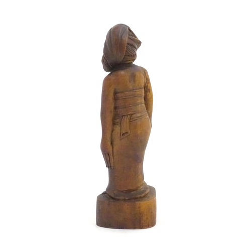 1184 - Ethnographic / Native / Tribal: An African carved wood figure modelled as a lady holding a vessel. A... 