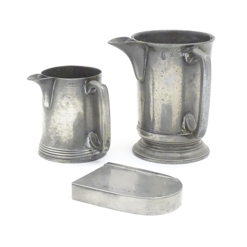 1191 - Two Victorian pewter measure jugs of tankard form, marked pint, and 1 quart, one by W. F. Loftus of ... 