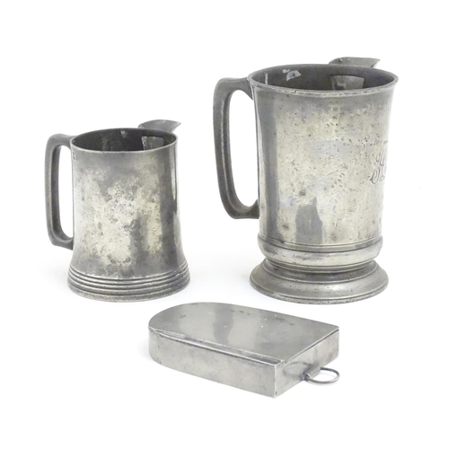 1191 - Two Victorian pewter measure jugs of tankard form, marked pint, and 1 quart, one by W. F. Loftus of ... 