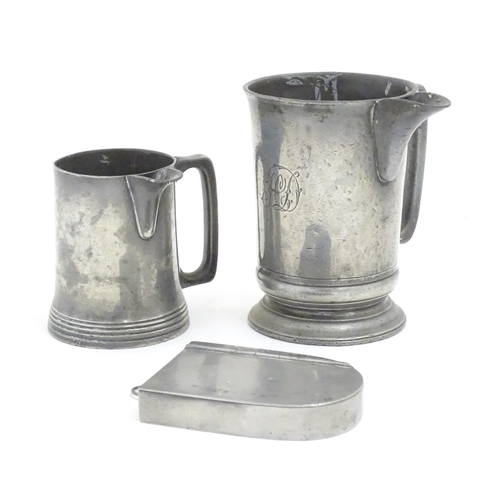 1191 - Two Victorian pewter measure jugs of tankard form, marked pint, and 1 quart, one by W. F. Loftus of ... 